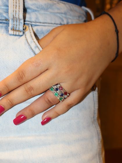 Stacked in colour, styled with love. A casual look featuring three of our handcrafted eternity bands in ruby, emerald, and sapphire, perfect for adding a pop of colour to your daily denim.