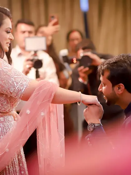 The classic proposal moment during an engagement ceremony. He gets down on one knee to kiss her hand, a timeless gesture of love and commitment that I love to capture.