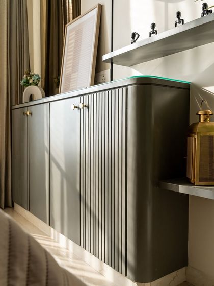 Lines that lead the eye, curves that calm the soul. This fluted matte-finish console is more than storage, it’s sculptural elegance. The ribbed detailing adds rhythm, while rounded edges soften the form.