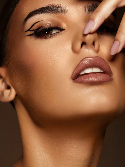 A close-up of a sharp, double-winged graphic liner. This is the kind of high-impact, technical skill that makes a portfolio stand out.