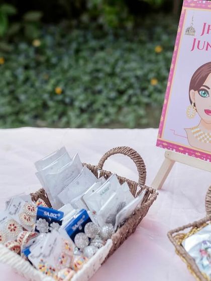 A "Jhumka Junction" favor station, where guests can pick their own traditional earrings. It's a small, interactive detail that adds a lot of fun to a Mehendi party.