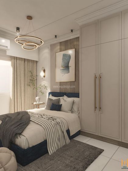 A full view of the guest bedroom, showing the paneled wardrobe and the harmonious color scheme.