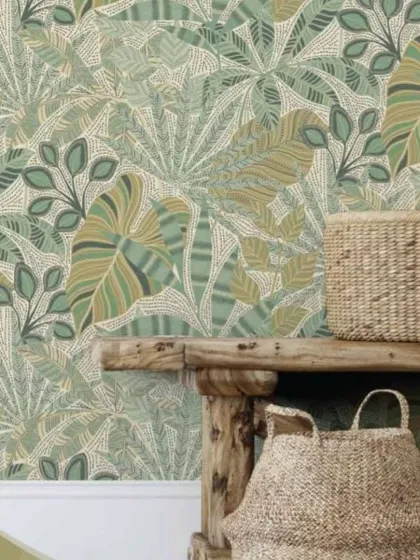 The tropical leaf pattern with a dotted background, shown here in a soft, light green. This version is subtle and stylish, adding texture and interest without overwhelming the room.