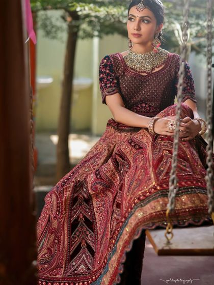 A candid moment on a swing, this shot captures the bride in a relaxed and joyful state. The movement of the swing adds a dynamic element to the portrait.