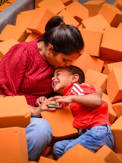 We're all about creating sweet family memories. Our soft foam pit isn't just for kids; it's a cozy spot for parents to share a laugh and a hug with their little ones.