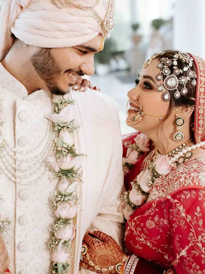 The gentle, knowing smiles exchanged between a couple on their wedding day are pure magic. This close up shot is all about intimacy. It’s in the way they look at each other that you see the entire story of their love, a quiet promise of forever.