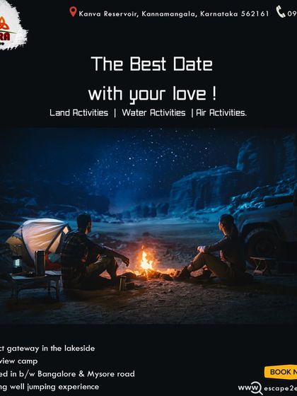 The best date with your love. A couple enjoys a private bonfire next to their tent and vehicle.