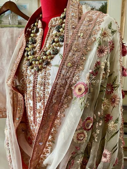 A close-up of the draped dupatta and neckline.