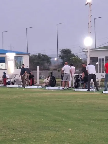 A wide view of the driving range, showcasing the multiple hitting bays and the open, green expanse that our players love.