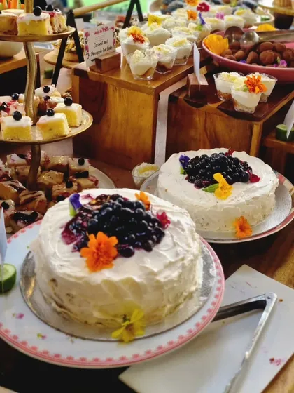 Our dessert offerings are crafted to be the perfect finale. Here, our delicate blueberry cakes are presented as part of a larger dessert table, showcasing our ability to create beautiful and delicious sweet experiences for any occasion.