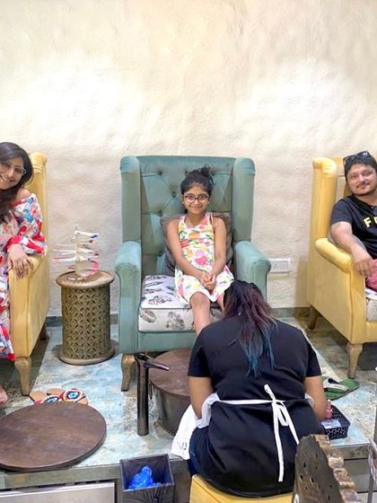 Our salon setup allows friends and family to get pampered together. These clients are enjoying pedicures side-by-side in our comfortable, high-backed chairs.