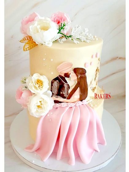 A lovely caricature cake for a sweet engagement party. The design featured a baby pink and gold color palette, with a hand-drawn style couple illustration and beautiful peonies. It’s a wonderful way to add a personal touch.