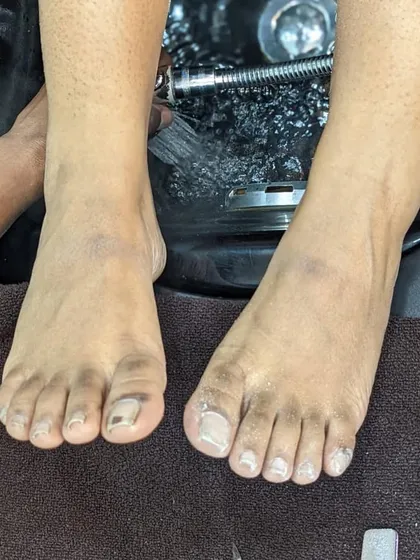 A "before" photo showing a client's feet soaking in our pedicure basin. This is the first step in our process to clean, refresh, and rejuvenate tired feet.
