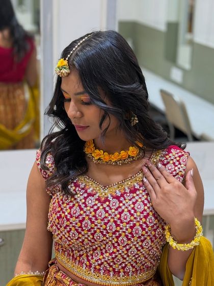 Another angle of the Haldi look, showing the harmony between the makeup, outfit, and accessories, a key aspect of our training.