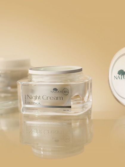 A shot of Natuos 365 Night Cream jars with reflections on a glossy surface. Reflections can add a sense of polish and high-end quality to product photos.