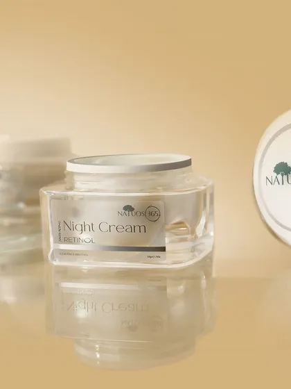 A shot of Natuos 365 Night Cream jars with reflections on a glossy surface. Reflections can add a sense of polish and high-end quality to product photos.