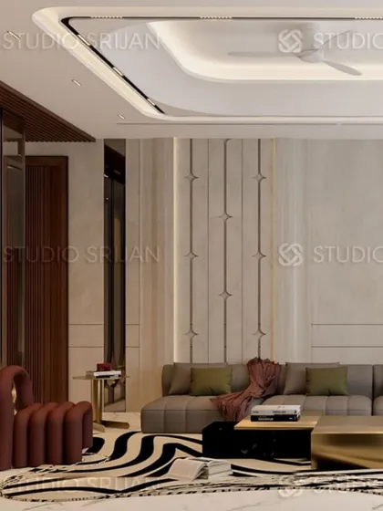 A view of the seating area, featuring a bold, sculptural armchair and a zebra-print rug that adds a touch of playful contrast to the otherwise serene and modern design.