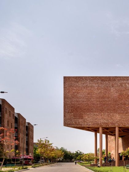 The Chandigarh University D-6 building by Charged Voids is a landmark on campus, with its bold, cantilevered brick form creating a dramatic presence.