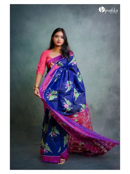 A full-body view of the blue and pink saree, allowing customers to appreciate the entire design.