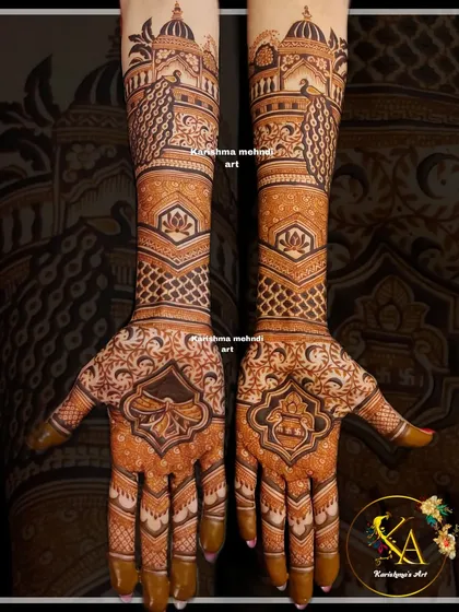 This design captures the grandeur of a royal wedding with its focus on architectural and traditional motifs. It features majestic palace domes and peacocks on the forearms, flowing down into intricate patterns on the palms for a truly regal bridal look.