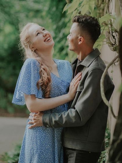 Pure, uninhibited laughter. This close-up of Natalia and Jaipal captures the genuine happiness and comfort they find in each other's company.