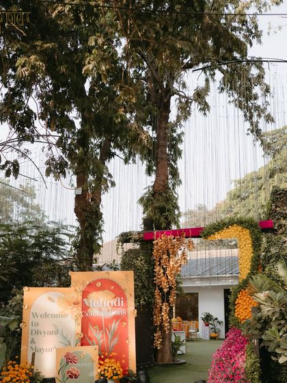The entrance to this vibrant Punjabi-themed Mehendi was a celebration of color and tradition. Welcome signs and arches adorned with marigolds and golden flowers set a festive and joyful tone from the start.