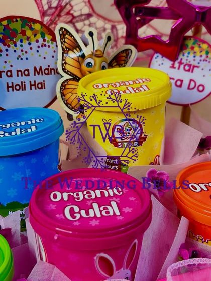 We call this platter "Summer's Here." It's loaded with organic gulal in ice cream-style cups and other fun props for a playful Holi.