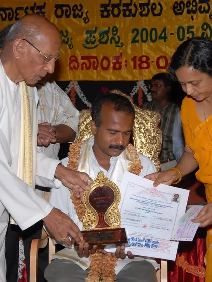 Another photo from the State Award ceremony, a cherished memory in my 35-year journey as a Mysore painting artist.
