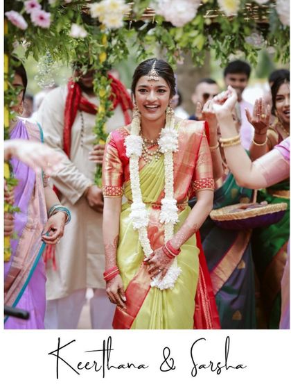 The bride's entrance under a floral phool chadar, a beautiful and joyous moment.