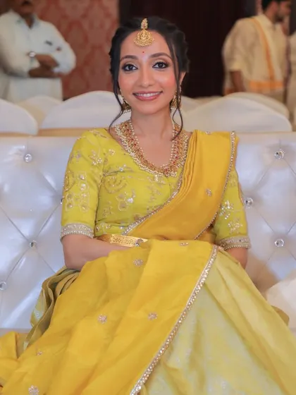 A beautiful smiling portrait. The makeup is light and fresh, with a focus on a natural glow and subtle elegance.