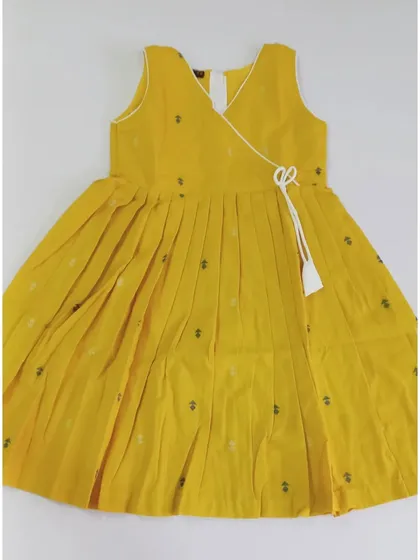 This is the turmeric yellow version of our Abhirami angrakha-style top. The pleated design and side tassel make it a stylish and comfortable choice for your little girl.