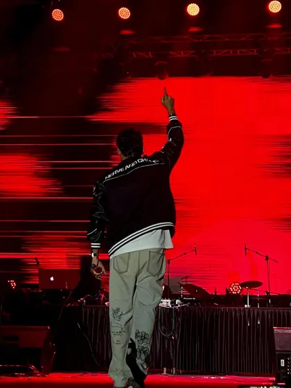 A powerful shot from behind at my IISC Bangalore show, with a massive red LED backdrop.