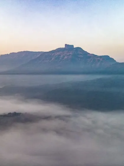 Winter is here. The Tahuli Peak near Badlapur on a cold winter morning, with a blanket of fog covering the valley below.