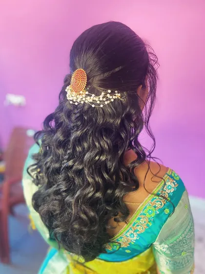 A close-up of the curls and the traditional hair accessory.