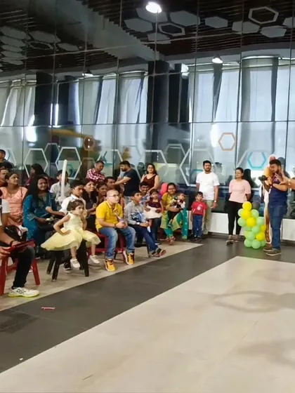 Here I am, performing for a wonderful audience of children and adults at Opus Consulting Services. My workshops are a great fit for corporate family days and events, bringing everyone together for a shared experience of wonder and fun.