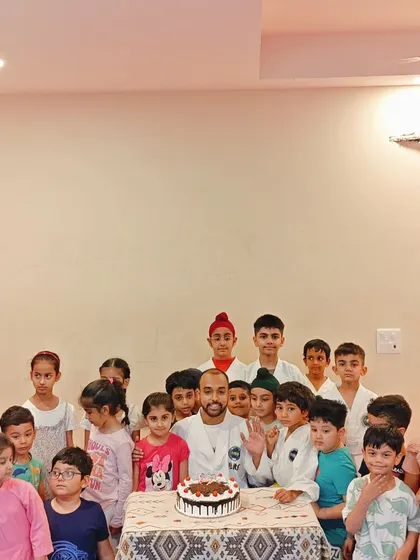 Waving to the camera with my students. These celebrations are a wonderful break from our intense training.