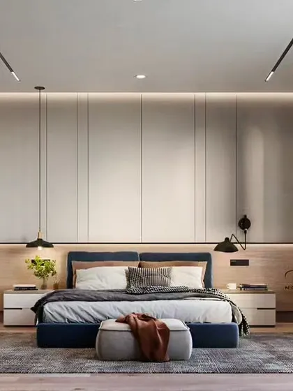 We designed this master bedroom as a tranquil retreat, with a focus on clean lines and sophisticated comfort. The floor-to-ceiling panelled wardrobe provides ample storage while the combination of ambient and task lighting creates a warm, inviting atmosphere.