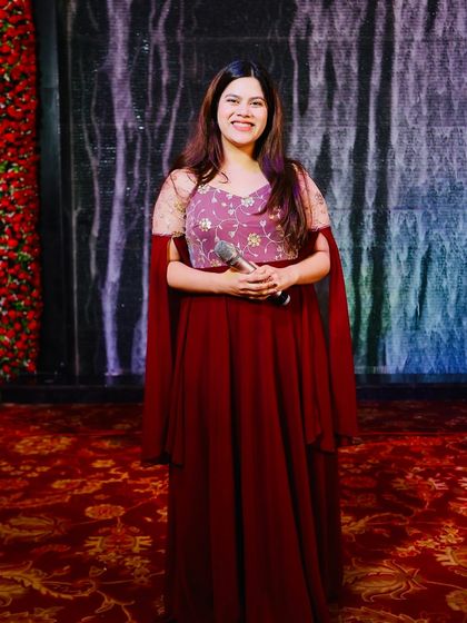 A happy, relaxed photo of me on stage. A comfortable host makes for a comfortable and fun event.