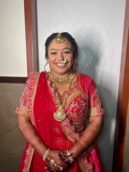 A gorgeous bride ready for her wedding day. I created a classic look with defined eyes and a warm, glowing complexion to match her traditional red and gold outfit.