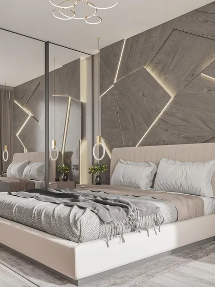 This modern bedroom features a unique geometric accent wall with backlighting, creating a dynamic and stylish focal point that reflects a contemporary urban lifestyle.
