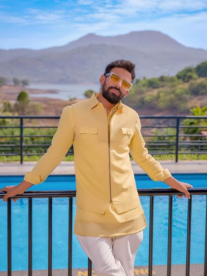 Shine bright at your day wedding. This yellow bandhgala from the Sukoon collection is designed for the man who wants to radiate joy and confidence.