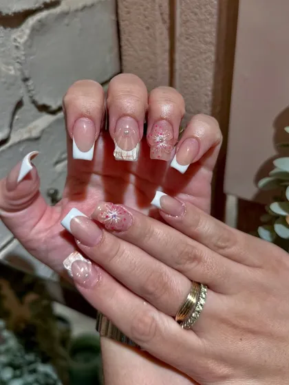A stunning example of 3D floral art on a classic square French tip. This is how we elevate a timeless look for a modern bride or special event.