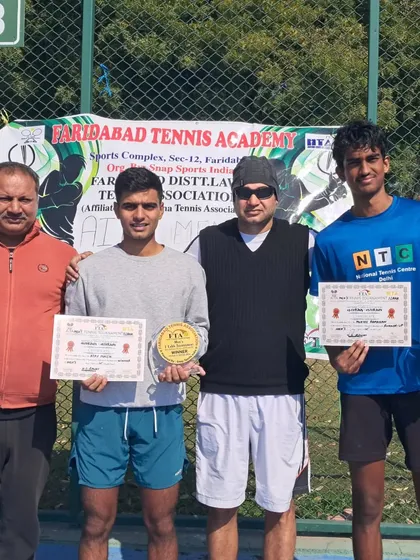 NTC player Mukil Ramanan receiving his runner-up prize after a close final match at the Faridabad 1 Lac AITA Men's tournament.