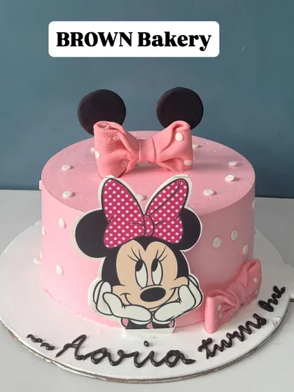 A sweet Minnie Mouse cake for Aaria's first birthday. This is a vegan fruit-flavored cake, showing that we can accommodate dietary needs without sacrificing a fun design.