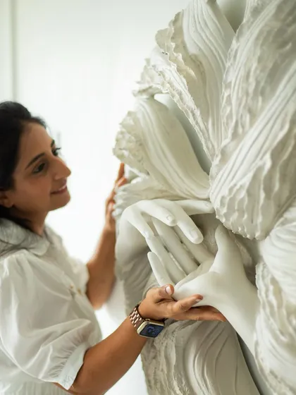 A close-up moment with 'The Awakening Cycle series 2'. The details are where the story lives, in the gentle touch of the hands and the flow of the surrounding textures.