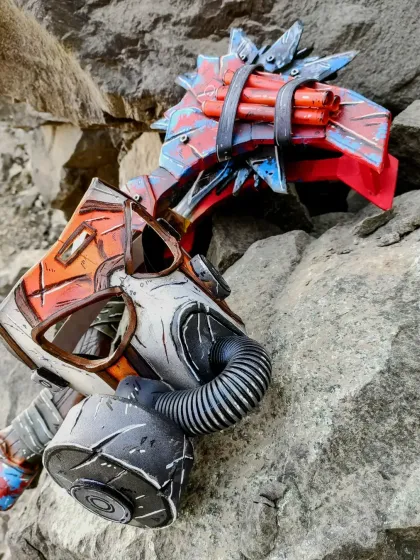 The finished and fully painted Krieg mask and Buzz-axe, looking like they were pulled straight out of the game. The weathering and battle-damage effects were fun to create.