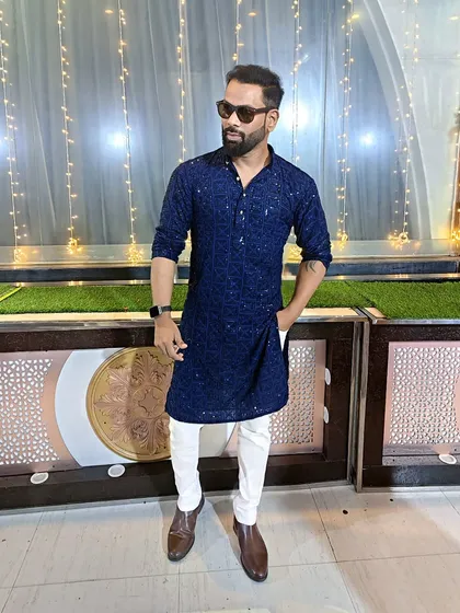 My look for a Sangeet night. A sparkling blue kurta that shines bright under the party lights.