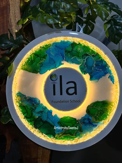 The logo sign glowing in a darker setting. The backlight creates a stunning halo effect around the logo.