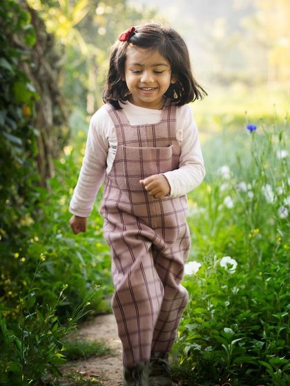 The simple joy of a toddler running through a field of flowers. I let kids explore and be themselves, which results in the most natural and happy photographs.