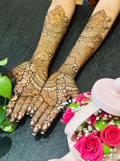 A full view of a stunning pre-engagement mehendi. The design is dense with paisleys and florals, offering a classic bridal feel that is both elegant and timeless.